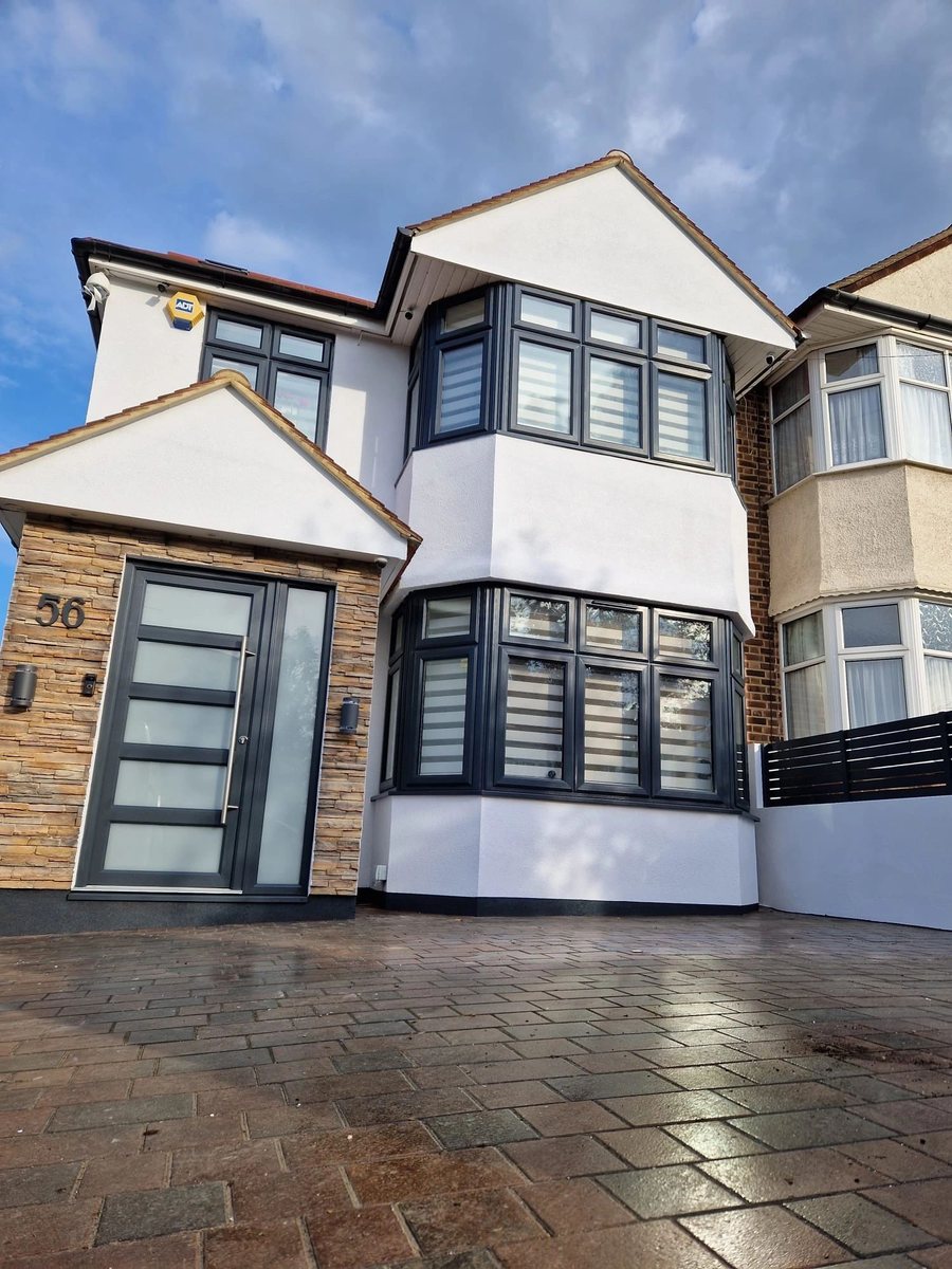 Freshly painted exterior house with updated windows