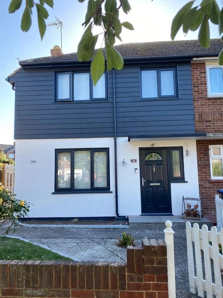 House frontage with refreshed dark window frames
