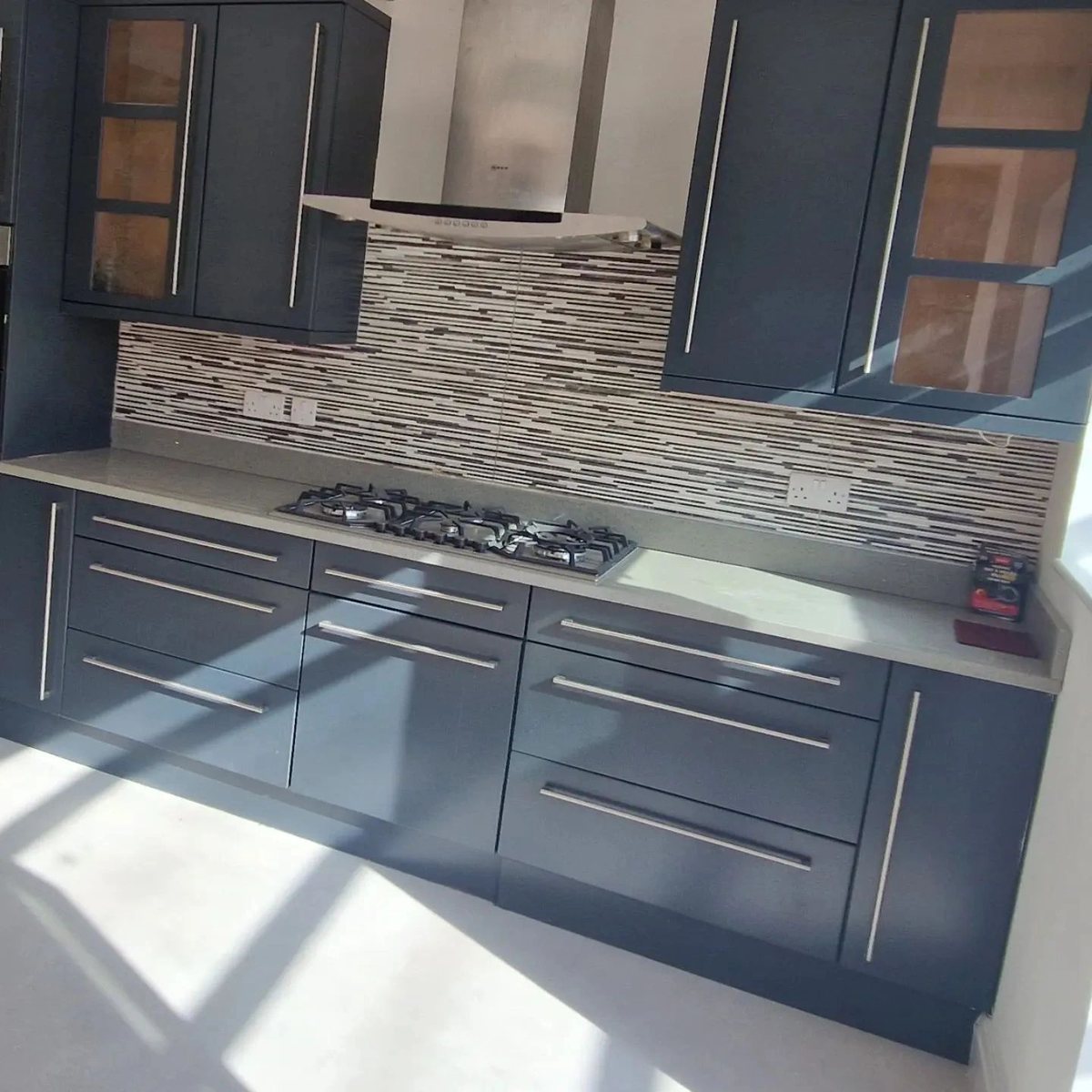 Kitchen cabinet doors sprayed in a dark grey finish